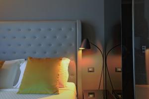 Postel nebo postele na pokoji v ubytování Palco Rooms&Suites