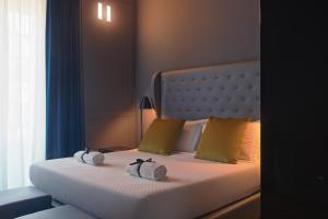 Postel nebo postele na pokoji v ubytování Palco Rooms&Suites