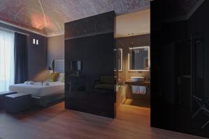 Postel nebo postele na pokoji v ubytování Palco Rooms&Suites