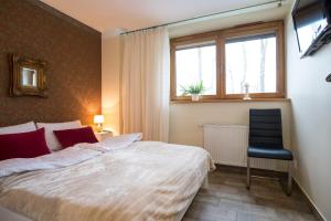 Posteľ alebo postele v izbe v ubytovaní Apartment Krupówki Premio