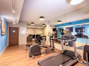 a gym with treadmills and elliptical machines at Holiday Inn Express Orange Beach - On The Beach, an IHG Hotel in Orange Beach