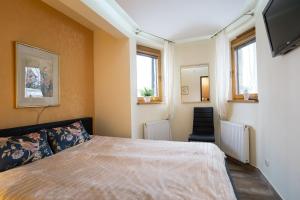 Posteľ alebo postele v izbe v ubytovaní Apartment Krupówki Premio