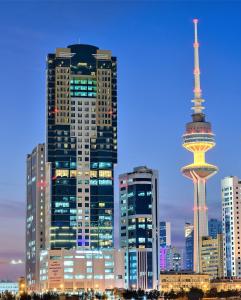 a city skyline with a view of the space needle at Grand Majestic Hotel Kuwait in Kuwait