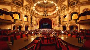 a large room with tables and chairs in a building at City Hotel Bosse in Bad Oeynhausen