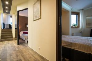 Posteľ alebo postele v izbe v ubytovaní Apartment Krupówki Premio