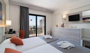 Postel nebo postele na pokoji v ubytování Medplaya Hotel Bali