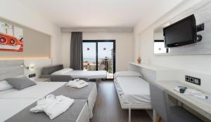 Postel nebo postele na pokoji v ubytování Medplaya Hotel Bali