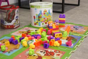 a childs toy set on a table with a can of toys at Vista Gudauri in Gudauri