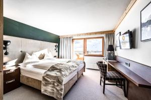Hotel Edelweiss & Gurgl客房内的一张或多张床位