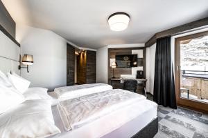 Hotel Edelweiss & Gurgl客房内的一张或多张床位