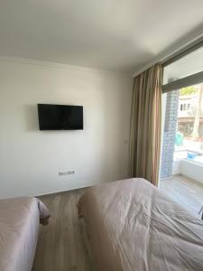 A bed or beds in a room at Apartamentos Maspalomas Foresta