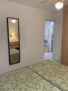 A bed or beds in a room at Apartamentos Maspalomas Foresta