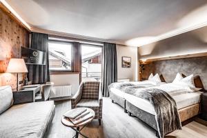 Hotel Edelweiss & Gurgl客房内的一张或多张床位