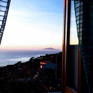 a view of the ocean from a window at Emidio House in Termini