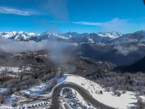 an aerial view of a mountain road in the snow at Apartment Pegase Phenix-1 by Interhome in Le Corbier