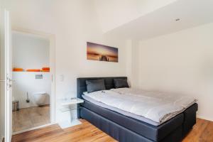 Postel nebo postele na pokoji v ubytování Hotel Hafermarkt