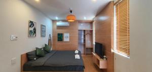 Llit o llits en una habitació de Quy Nhơn Balahouse