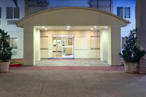 a large white building with a large doorway at Candlewood Suites LAX Hawthorne by IHG in Hawthorne