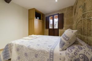 Postel nebo postele na pokoji v ubytování Gran Casa Rural A Touza