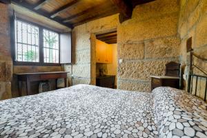 Postel nebo postele na pokoji v ubytování Gran Casa Rural A Touza