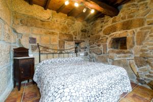 Postel nebo postele na pokoji v ubytování Gran Casa Rural A Touza