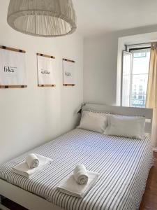 Ein Bett oder Betten in einem Zimmer der Unterkunft COM•BRO Apartment