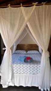 Ένα ή περισσότερα κρεβάτια σε δωμάτιο στο Casas Belas de Taipu