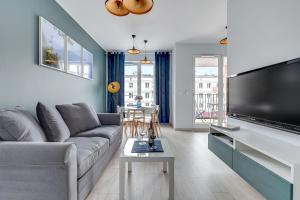 Televízia a/alebo spoločenská miestnosť v ubytovaní City Break Gdańsk Rajska 8 Apartamenty