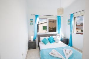 Postel nebo postele na pokoji v ubytování Villa Dionysos + 15 fotografií