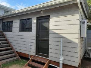a exterior view of a tiny house at Vogel's Nest in George