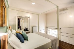 A bed or beds in a room at Casa Hosteno