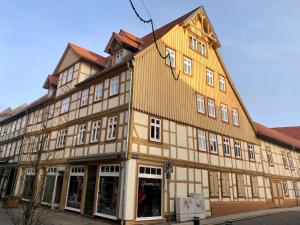 a large brown building with white windows at Mountain apart Ferienwohnungen im Harz in Wernigerode