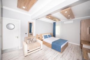 A bed or beds in a room at Marina Hotel Bodrum