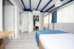 A bed or beds in a room at Marina Hotel Bodrum