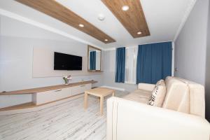 A television and/or entertainment centre at Marina Hotel Bodrum