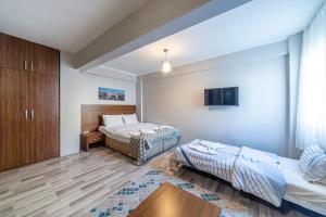Voodi või voodid majutusasutuse Carina Apart Hotel toas