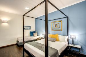 A bed or beds in a room at Casa Hosteno