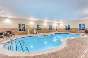a large swimming pool in a hotel room at Candlewood Suites Bethlehem South by IHG in Bethlehem