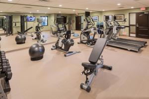 a gym with several treadmills and exercise bikes at Staybridge Suites Omaha West, an IHG Hotel in Omaha