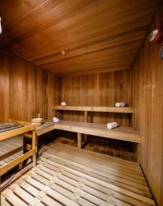 an empty sauna with wooden walls and wooden shelves at Naples Bay Resort and Marina in Naples