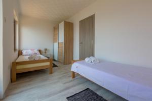 Postel nebo postele na pokoji v ubytování VILLA VISA