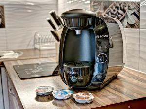 a coffee maker is sitting on a kitchen counter at Osada Harenda in Zakopane