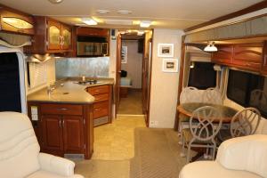 a kitchen and living room of an rv at Tower 64 Motel & RV in Trinidad