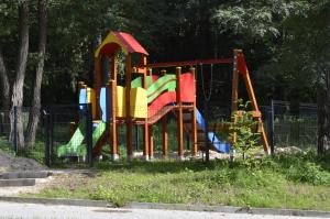 a playground in a park with a colorful slide at "11" SŁOŃCE WODA LAS - Apartament No11 Garaż w cenie in Kielce