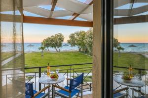 a view of the ocean from the balcony of a resort at Naftilos Residences I in Potokáki