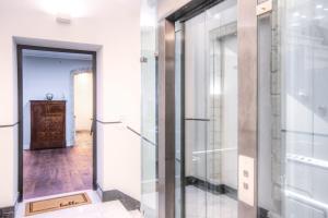 a glass door leading into a room with a hallway at Right House di Via Sulis - Best Neighborhood in the Town in Cagliari