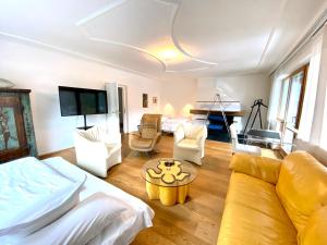 a living room with a couch and a table at Appartements Greier in Telfes im Stubai