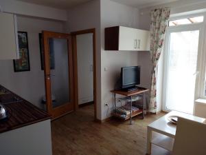 TV a/nebo společenská místnost v ubytování Apartman29