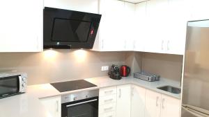 Kuchyň nebo kuchyňský kout v ubytování Avenida de Arteixo. Precioso apartamento