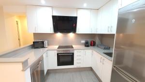 Kuchyň nebo kuchyňský kout v ubytování Avenida de Arteixo. Precioso apartamento